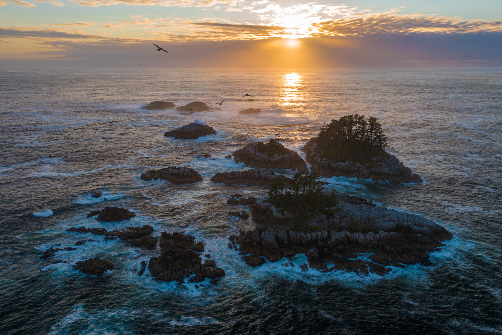 Rocky islands in the sea with sunset