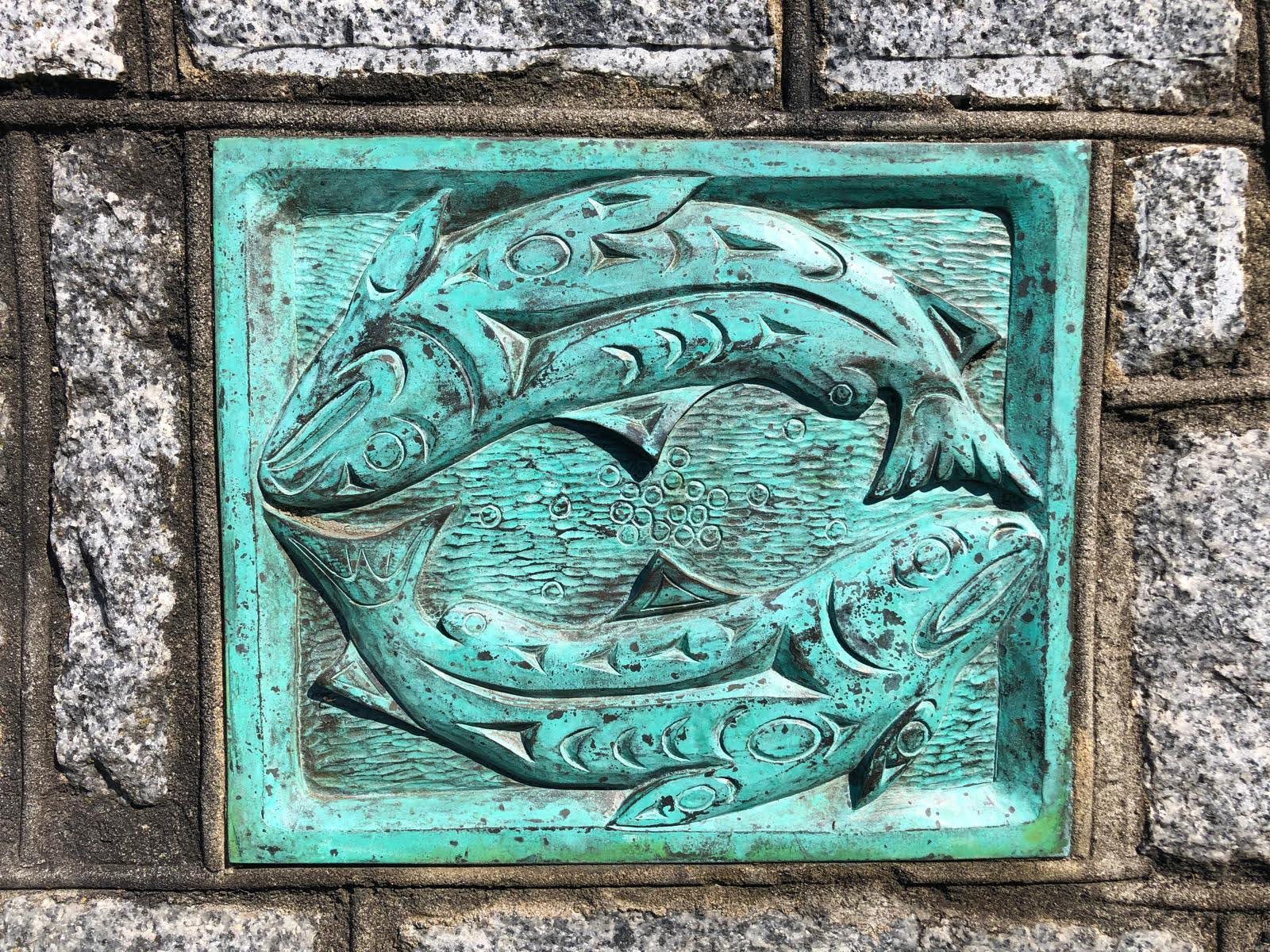 Art by Charles Elliot Temoseng, located beneath a plaque on Fort St.